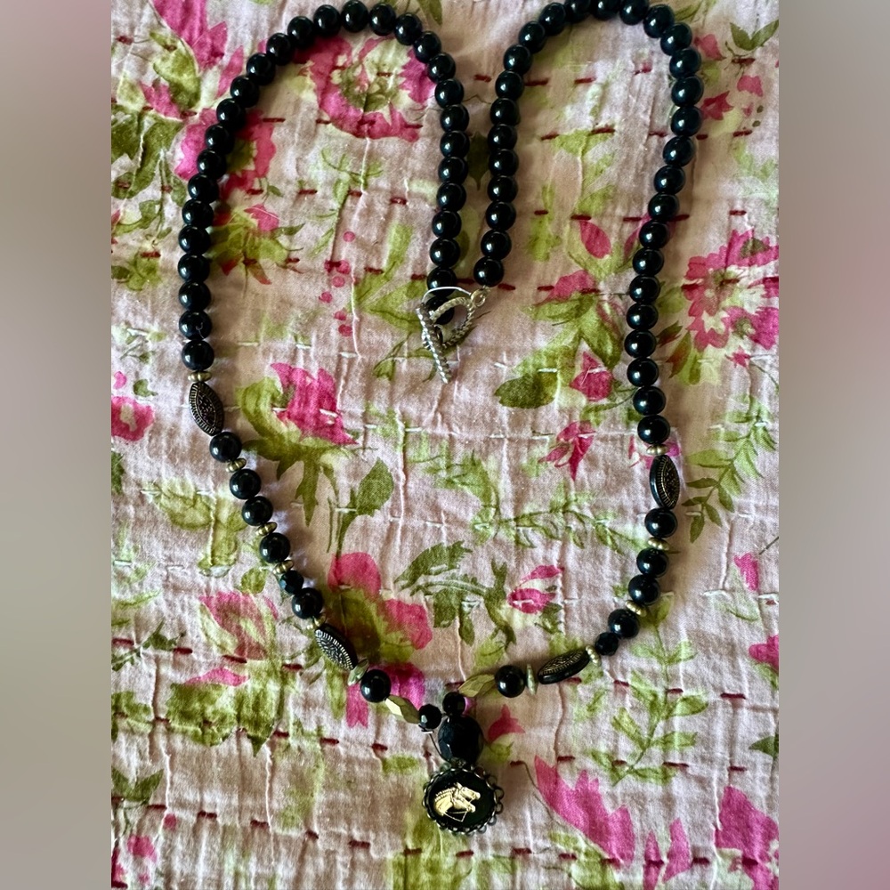 Vintage black beaded necklace with Horse charm